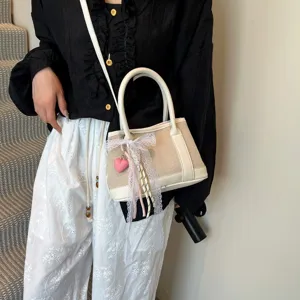 Bolso bandolera informal de lona con lazo, bolso de mano elegante para uso diario de mujer.