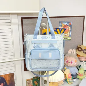 Sac cabas en toile bleu et blanc avec étoiles, oreilles de chat et fenêtre transparente.