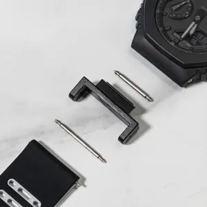 Replacement watch strap connector and silicone band set for G-Shock sports watch modification.