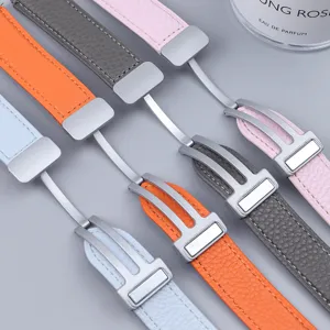 Detail shot of litchi texture leather watch strap with metal folding magnetic clasp in colors.