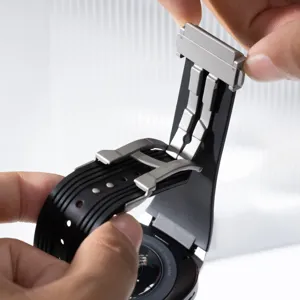 Silicone watch strap with stainless steel deployment clasp for smartwatch replacement.