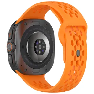 Back detail view of 47mm smartwatch featuring orange perforated silicone replacement strap.