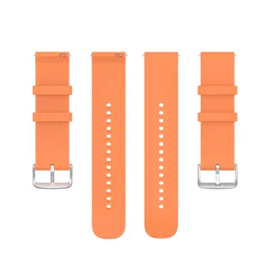 Smooth orange silicone watch strap detail, featuring a secure metal buckle and quick-release pin.