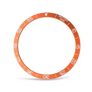 Anneau de protection de lunette de montre en métal orange avec marquages d'échelle.