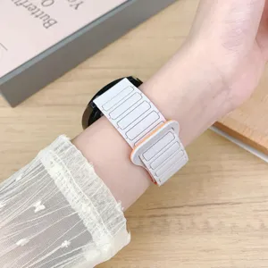 Two-tone silicone magnetic loop watch strap replacement for universal smartwatches.