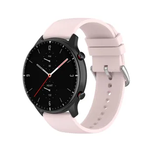 Detailed view of smooth pink silicone watch strap with metal buckle and black smartwatch.