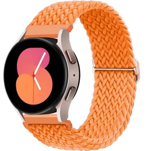 Nylon braided watch strap replacement detail in bright orange color with metal buckle.