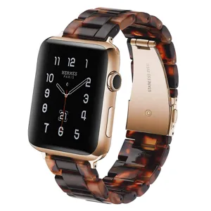 Resin watch band replacement strap detail view with tortoise shell pattern and rose gold metal.