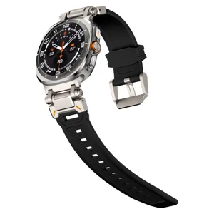 Close-up detail of the rugged metal connector lug and black silicone watch band.