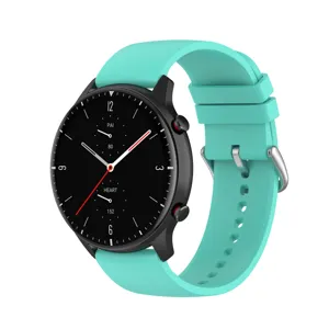 Close-up view of the mint green smooth silicone watch band with silver buckle detail.
