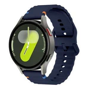 Detailed view of the wave silicone watch strap with contrast stitching, flexible and durable.