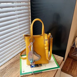 Yellow vertical crossbody phone bag, niche design chic summer commuting fashion style accessory.