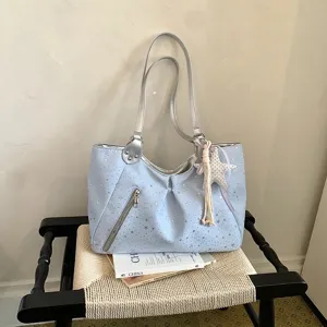 Stylish light blue star print shoulder tote bag for women, casual commuter handbag daily use.