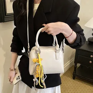 Chic leather shoulder crossbody bag for women, stylish commuting handbag with handle and strap.