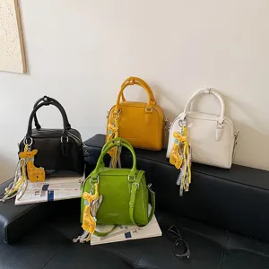 Classic stylish commuter boston shoulder bag with cute giraffe pendant for women daily wear