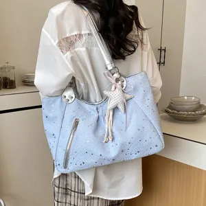 Chic light blue star print shoulder tote bag for women, stylish commuting handbag with charm.