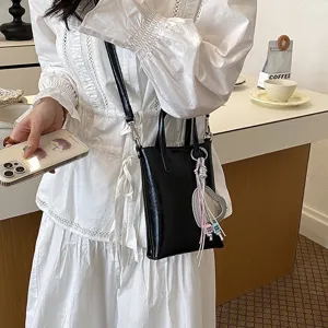 Chic black vertical crossbody phone bag for women, trendy niche design shoulder mini bag.