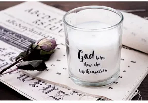 Decorative sticker detail shot on glass jar with inspirational English quote typography.