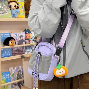 Casual purple grid crossbody phone bag with cute plush pendant, versatile trendy design.