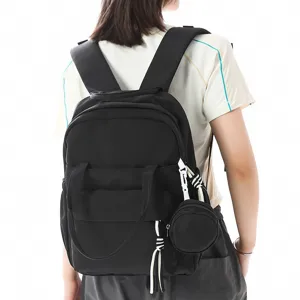 Sac à dos noir femme élégant et léger pour l'école voyage loisirs avec petite pochette ronde
