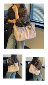 Detailed view of the Korean style canvas tote bag, showing shoulder wear and heart pendant.