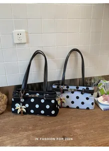 Sac à épaule élégant à pois pour femmes avec fermoir en métal pour le shopping d'été.