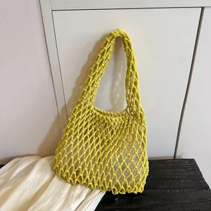 Yellow woven net shoulder bag detail, casual knit hobo purse view, stylish daily accessory.