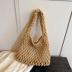 Handmade knitted mesh shoulder bag detail, casual hollow tote bag in khaki color.
