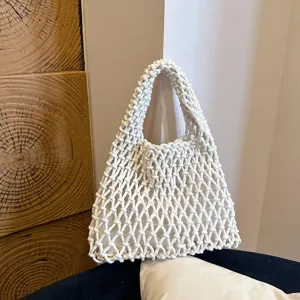 Woven macrame shoulder bag detail, white hollow knit texture, stylish niche daily accessory.
