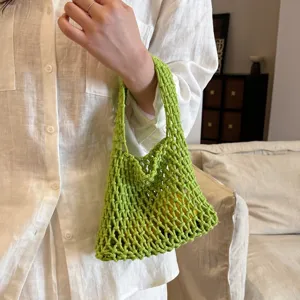 Green crochet net shoulder bag, simple niche design mesh handbag for women spring 2026.
