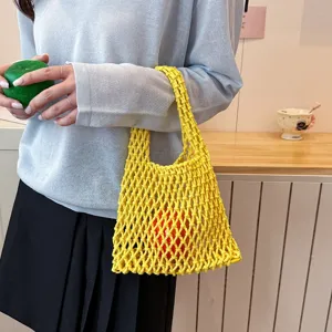 Stylish yellow woven mesh shoulder bag for women, trendy minimalist design casual handbag.