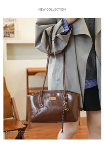 Casual large capacity PU shoulder bag for women, lightweight stylish commuting tote bag.