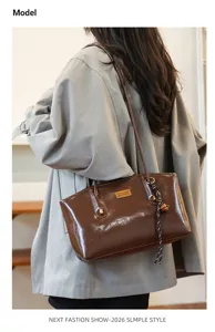 Stylish brown PU leather shoulder tote bag for women, lightweight casual commuter bag.