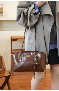 Brown PU leather shoulder bag detail, large capacity, lightweight and versatile for daily work.