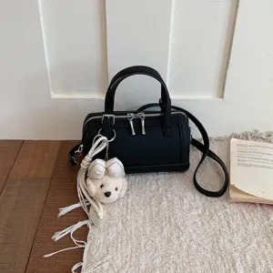 Black chic shoulder pillow bag with cute plush bow charm, trendy commuter crossbody bag for women