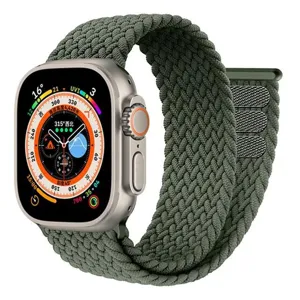 Detailed view of the green braided nylon watch strap with adjustable velcro design.