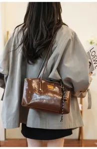 Relaxed casual brown PU leather shoulder bag, stylish large capacity tote for women daily commute.