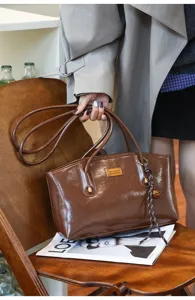 Brown PU leather tote bag for women, large capacity shoulder bag for daily commute style.