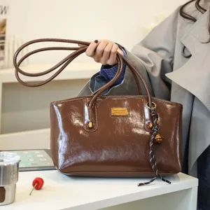 Casual large capacity PU leather shoulder bag for women, versatile and lightweight commuter tote.