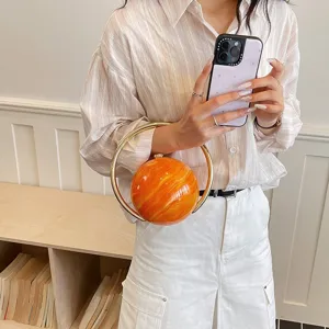Stylish marbled round evening handbag with gold ring handle for women chic commuter party detail