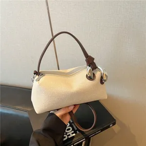 Vue détaillée du sac porté épaule décontracté pour femme avec poignée marron et anneau métal.
