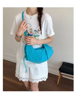 Casual blue canvas shoulder bag for women, stylish large capacity hobo tote for daily commute.