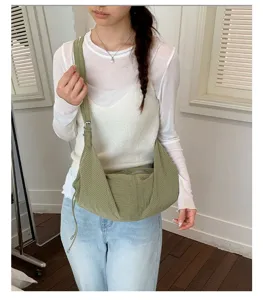 Casual green grid canvas shoulder bag, daily commuting tote bag with adjustable strap detail.