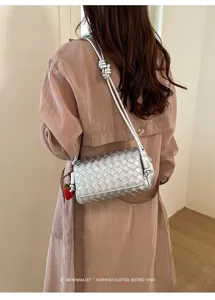 Silver woven shoulder underarm bag with chic strawberry charm for women trendy daily use.