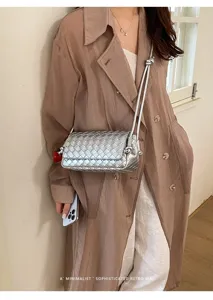 Silver woven crossbody bag for women, stylish leather shoulder purse with retro aesthetic design.