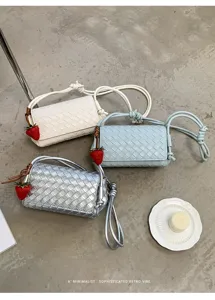 Trendy woven shoulder bag for women, stylish crossbody purse with cute strawberry charm.