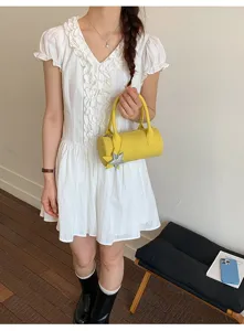 Korean style solid yellow cylinder handbag detail view featuring a cute star charm pendant.