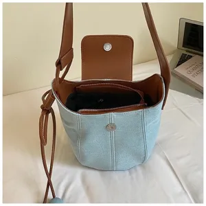 Women's denim bucket bag with brown leather contrast, large capacity casual crossbody bag.