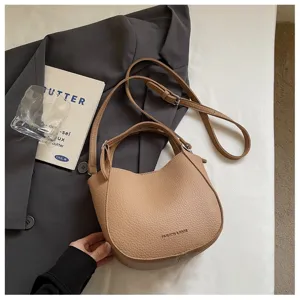 Sac seau minimaliste chic pour femmes, élégant sac bandoulière avec poignée et bandoulière.