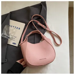 Sac à bandoulière élégant en similicuir rose pour femme, sac à main fourre-tout simple et chic.